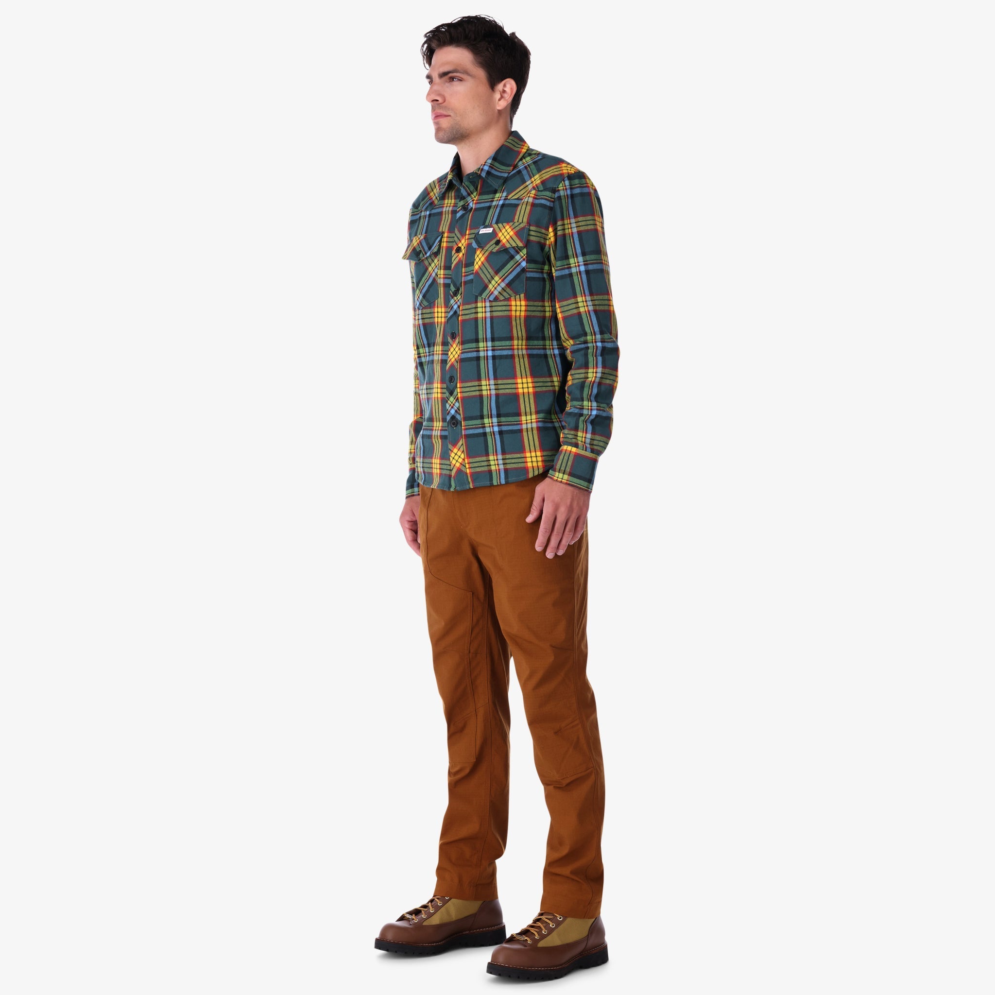 Topo Designs men's mountain organic cotton flannel shirt in "green multi" plaid on model.