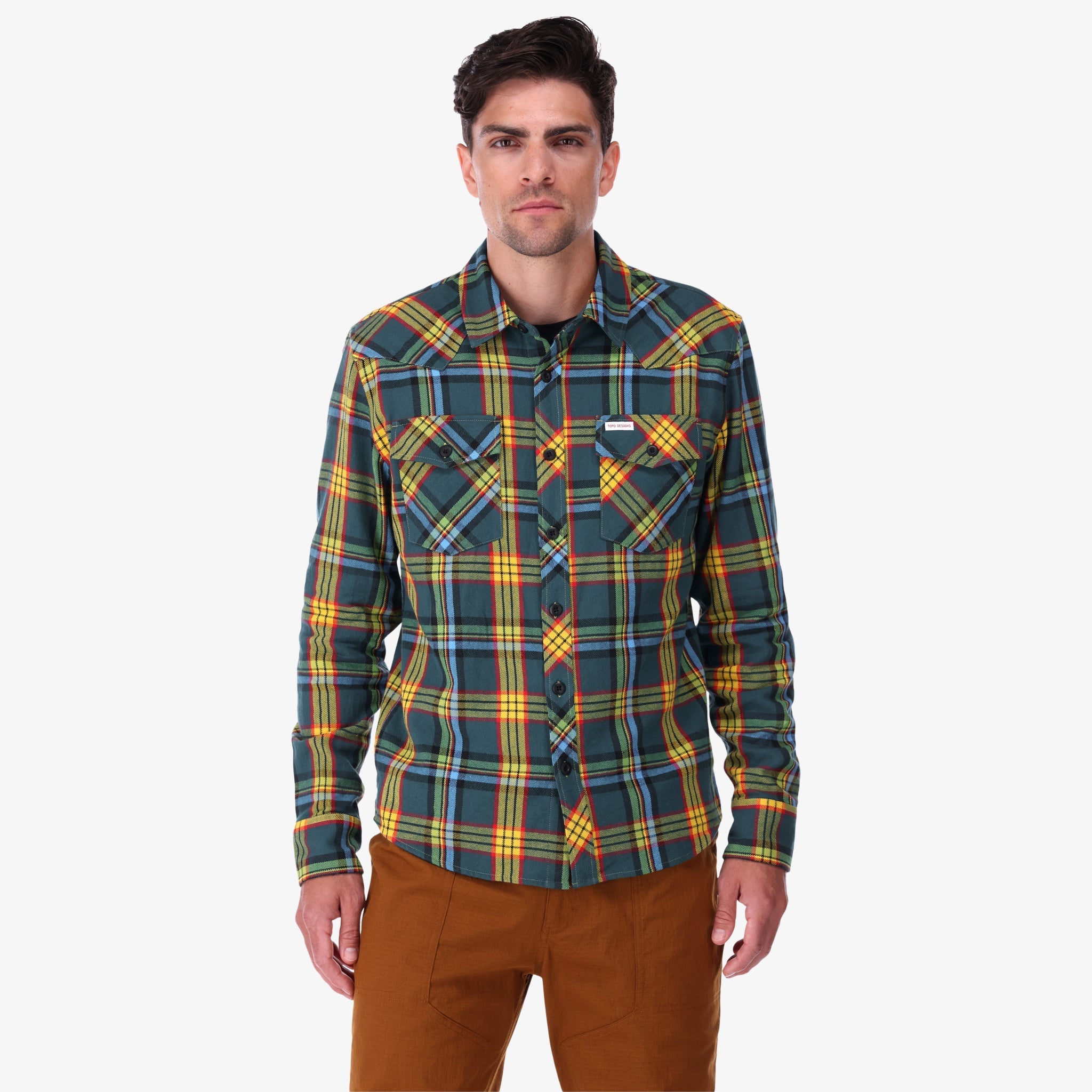 Topo Designs men's mountain organic cotton flannel shirt in "green multi" plaid on model.