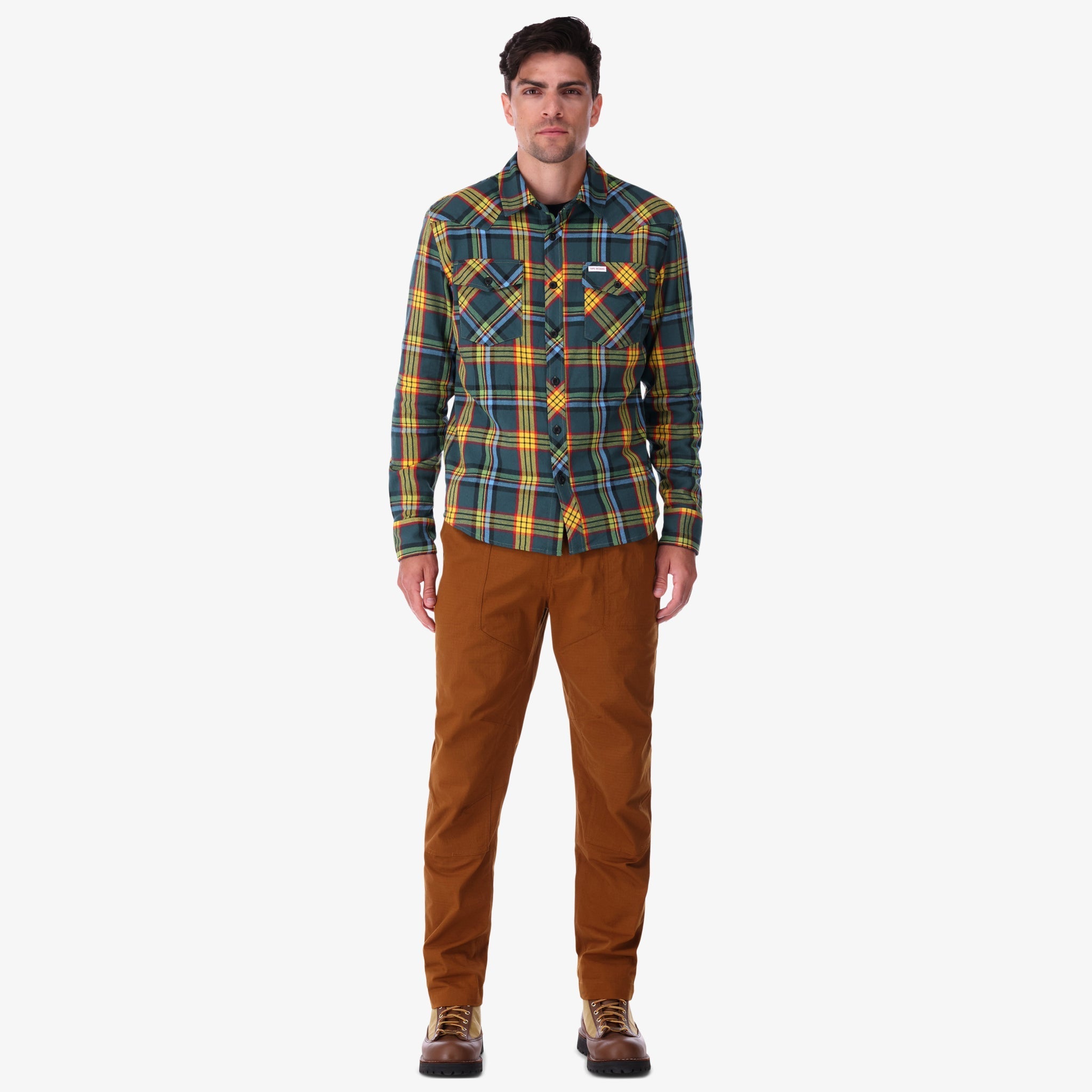 Topo Designs men's mountain organic cotton flannel shirt in "green multi" plaid on model.