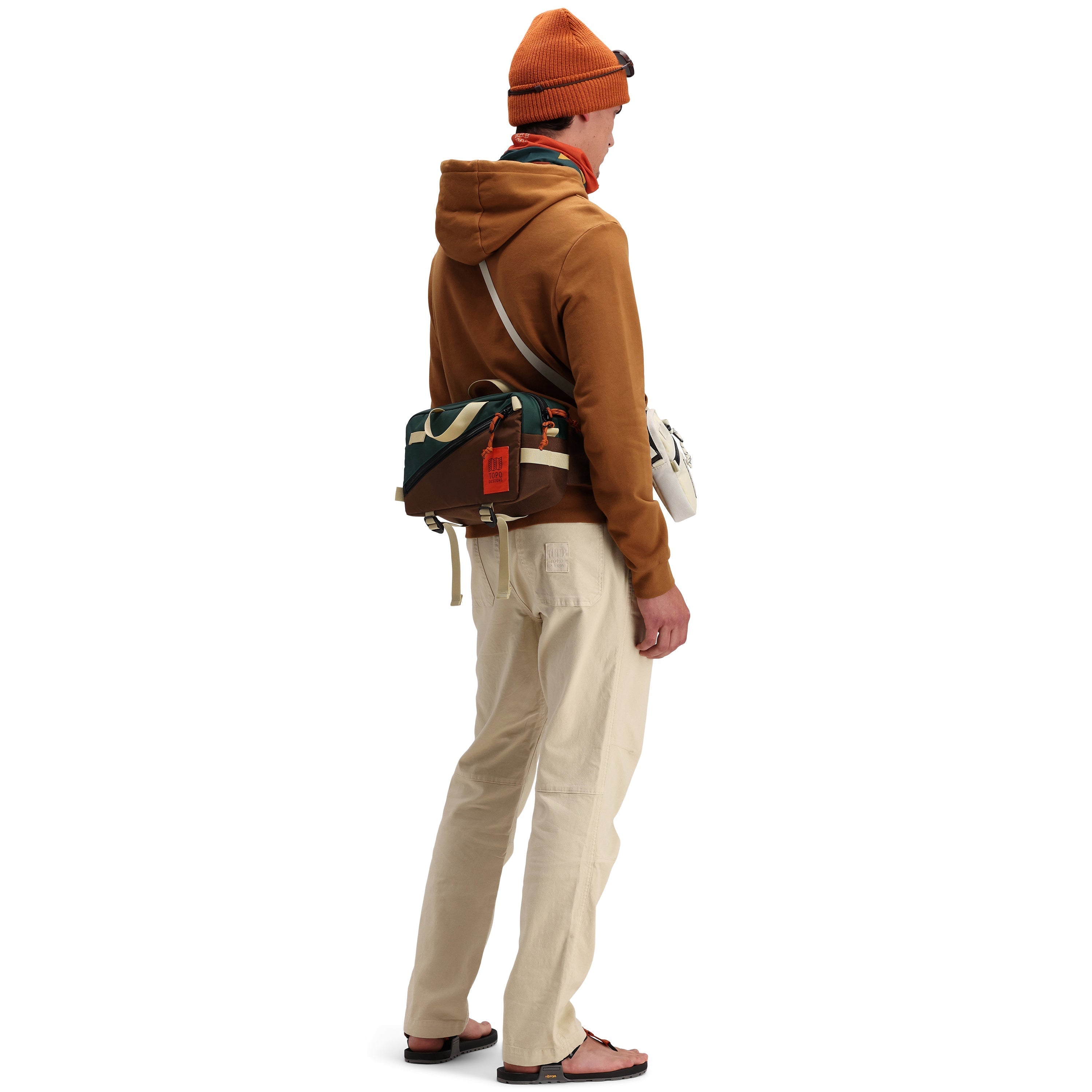 Back model shot of Topo Designs Men's Dirt Pants 100% organic cotton drawstring waist in "Sand" white