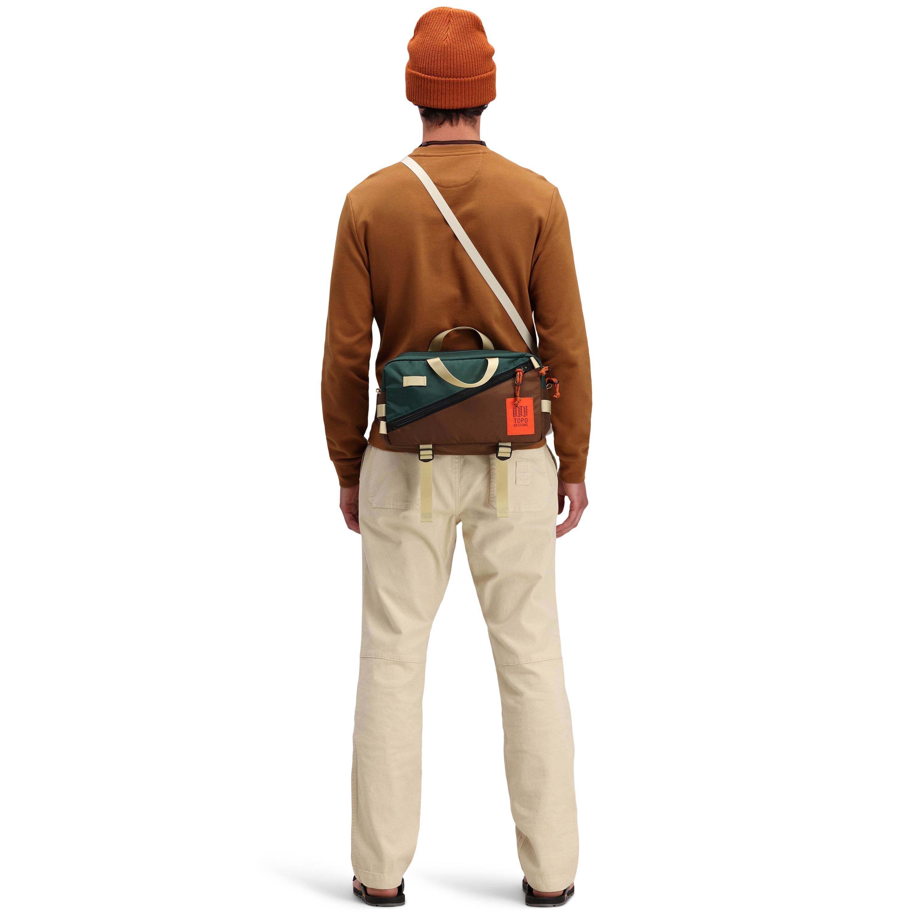 Back model shot of Topo Designs Men's Dirt Pants 100% organic cotton drawstring waist in "Sand" white