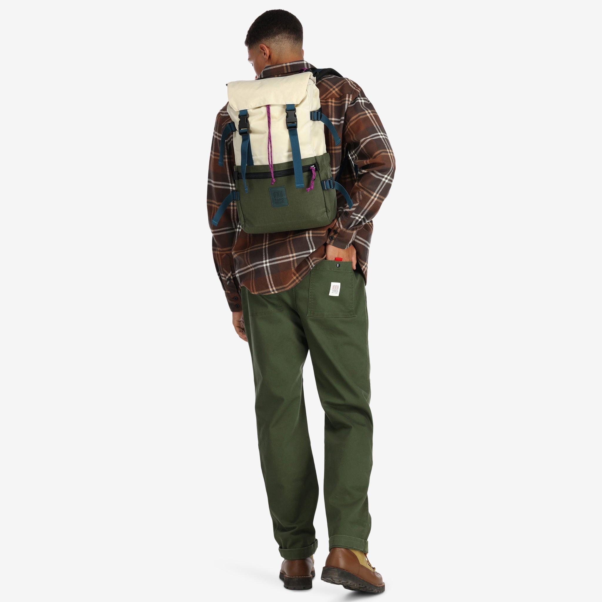 Back model shot of Topo Designs men's mountain organic cotton flannel shirt in "earth / tan plaid" brown