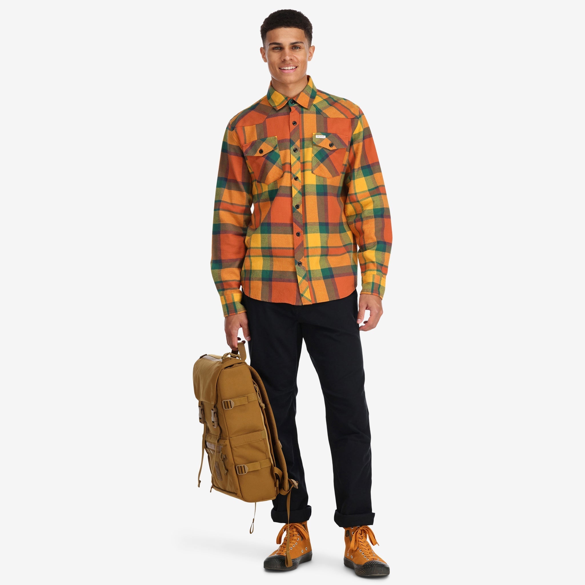 Front model shot of Topo Designs men's mountain organic cotton flannel shirt in "brick / mustard plaid" orange. Show on "blue multi" and "red multi"