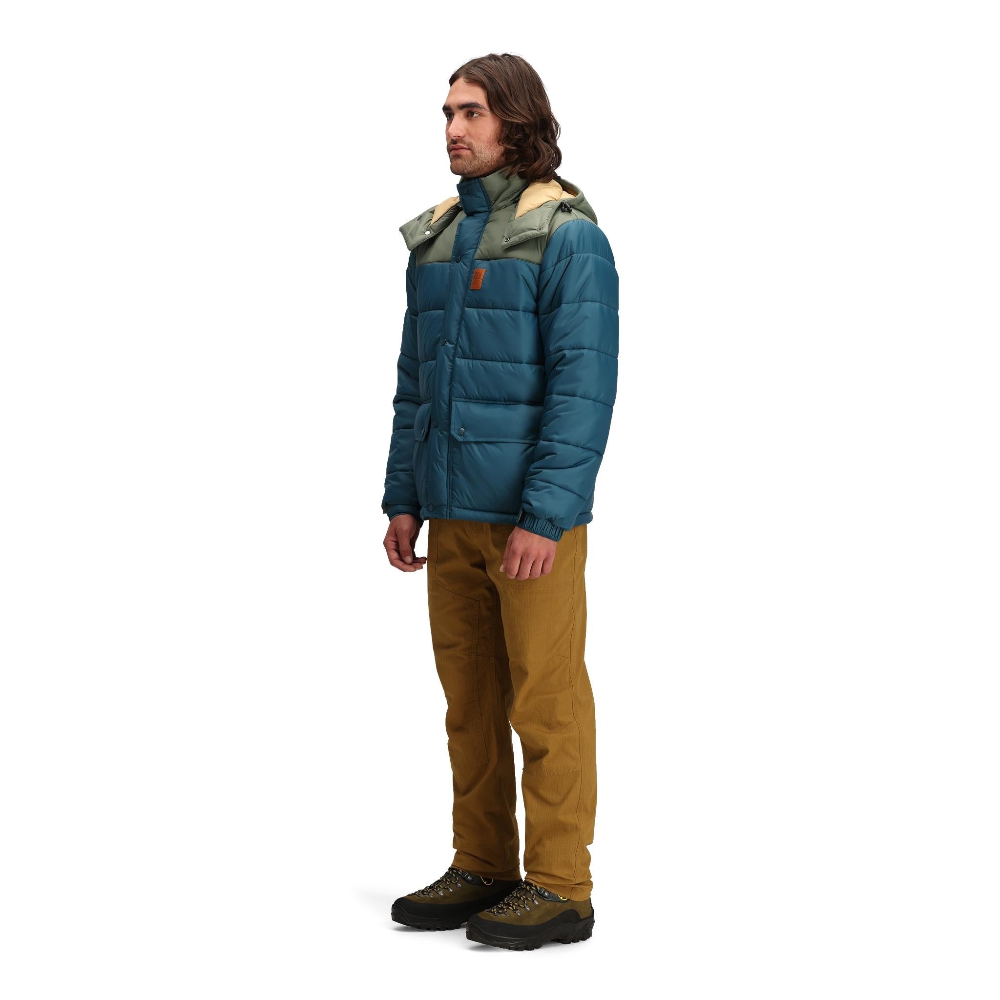 General side model shot of Topo Designs Retro Ridge Puffer Jacket - Men's  in "Pond Blue / Beetle"