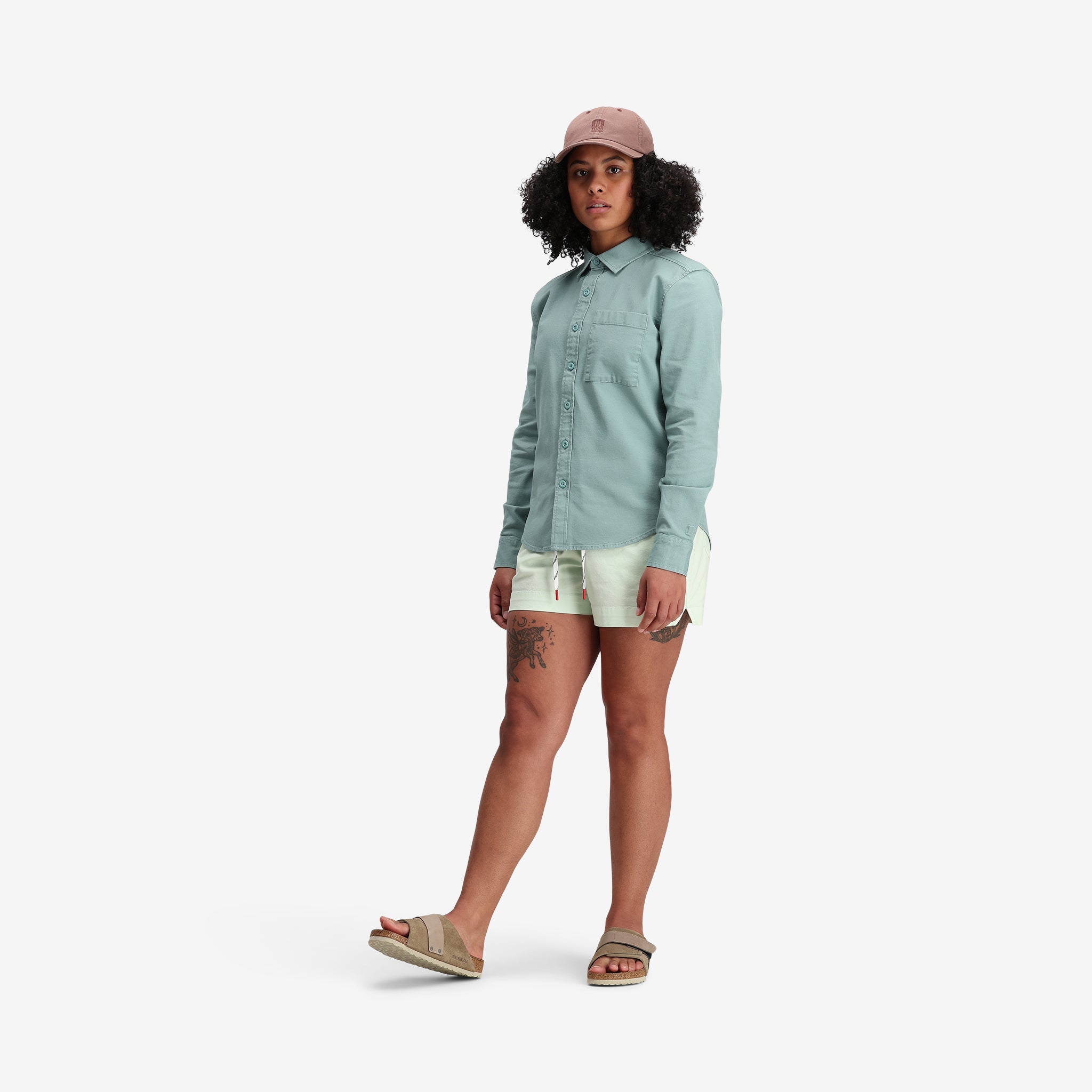 Model shot of Topo Designs Women's Dirt Shirt in "Sage" Green Blue.