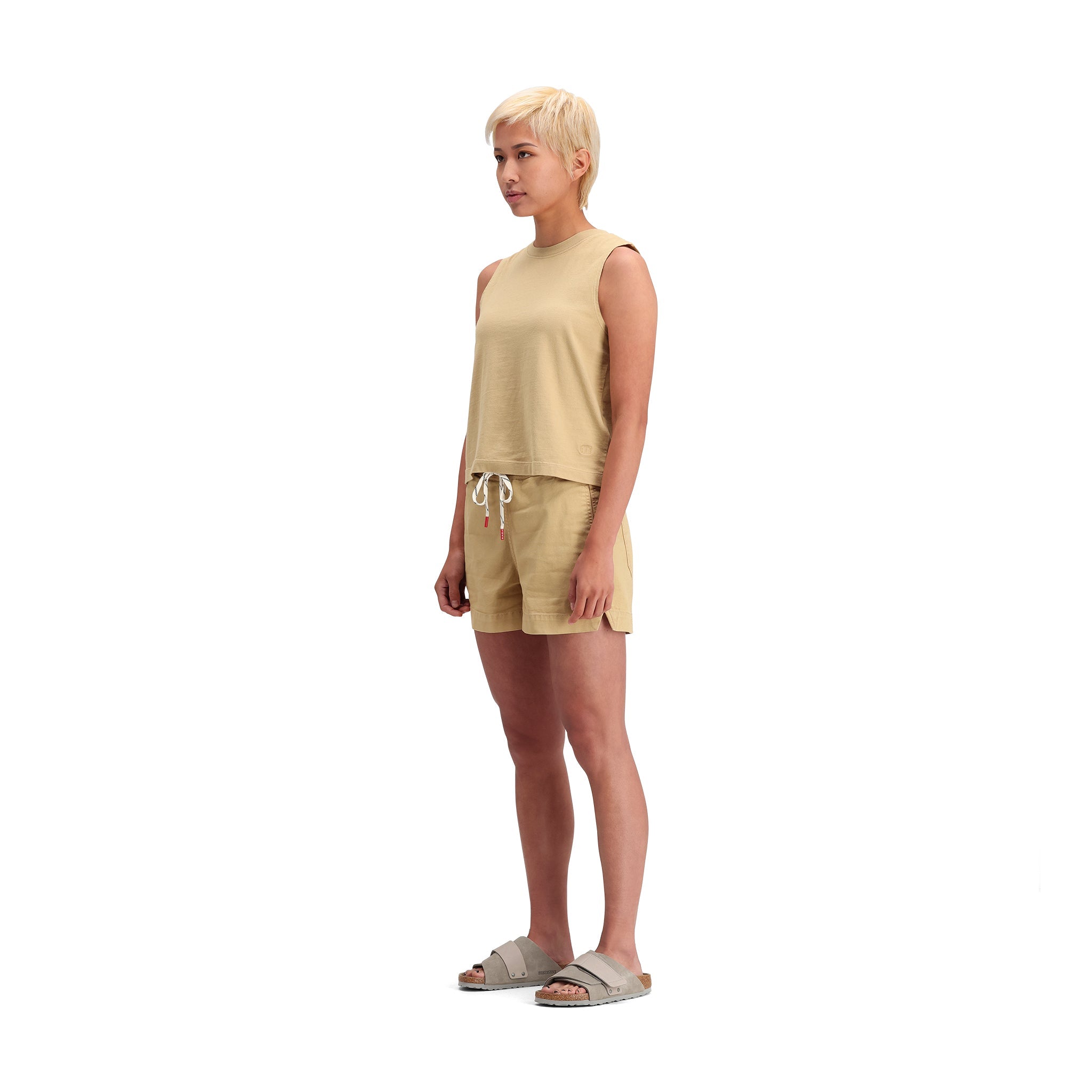 General side model shot of Topo Designs Dirt Tank - Women's in "Sahara"