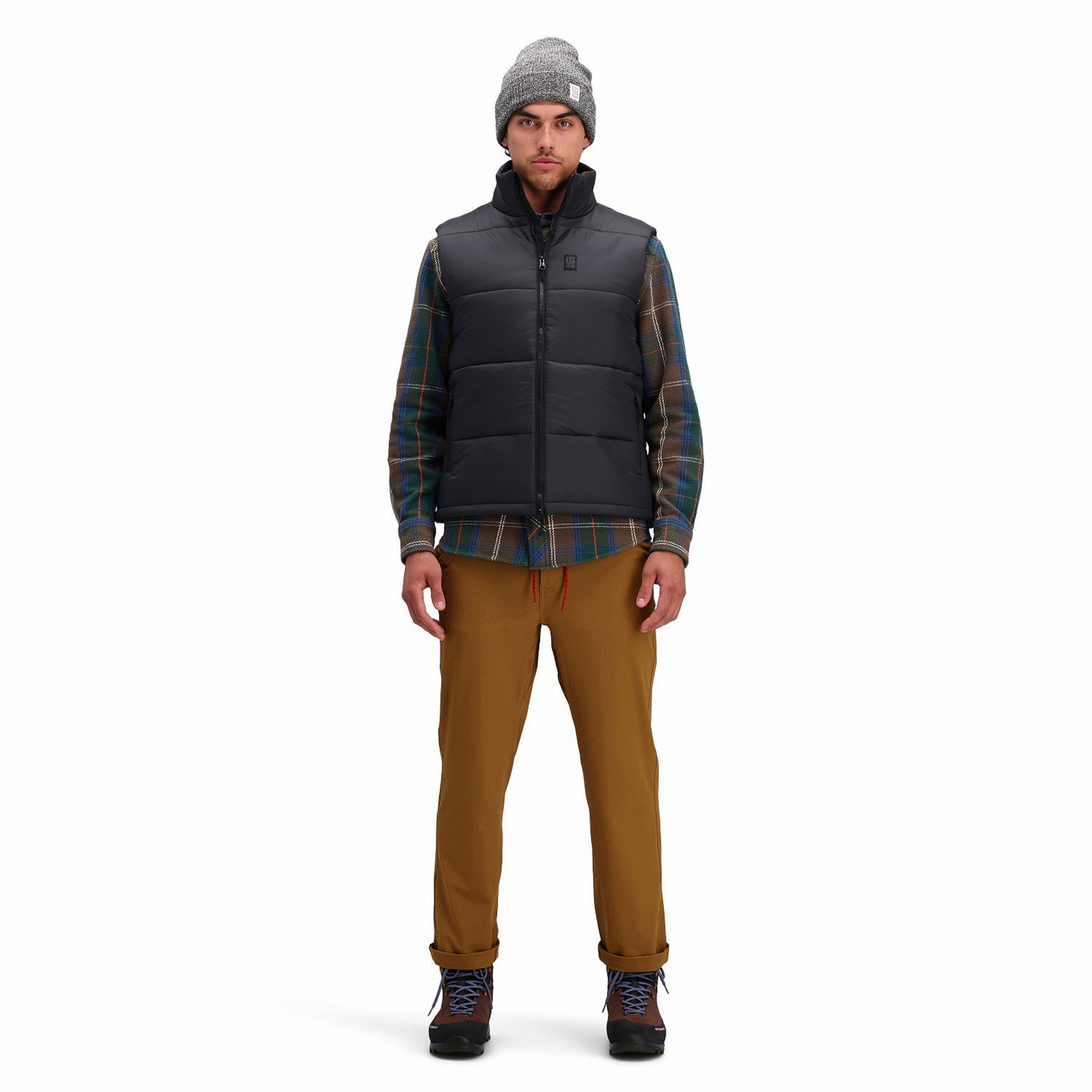 Front model shot of Topo Designs Men's Mountain Puffer recycled insulated Vest in "Black"