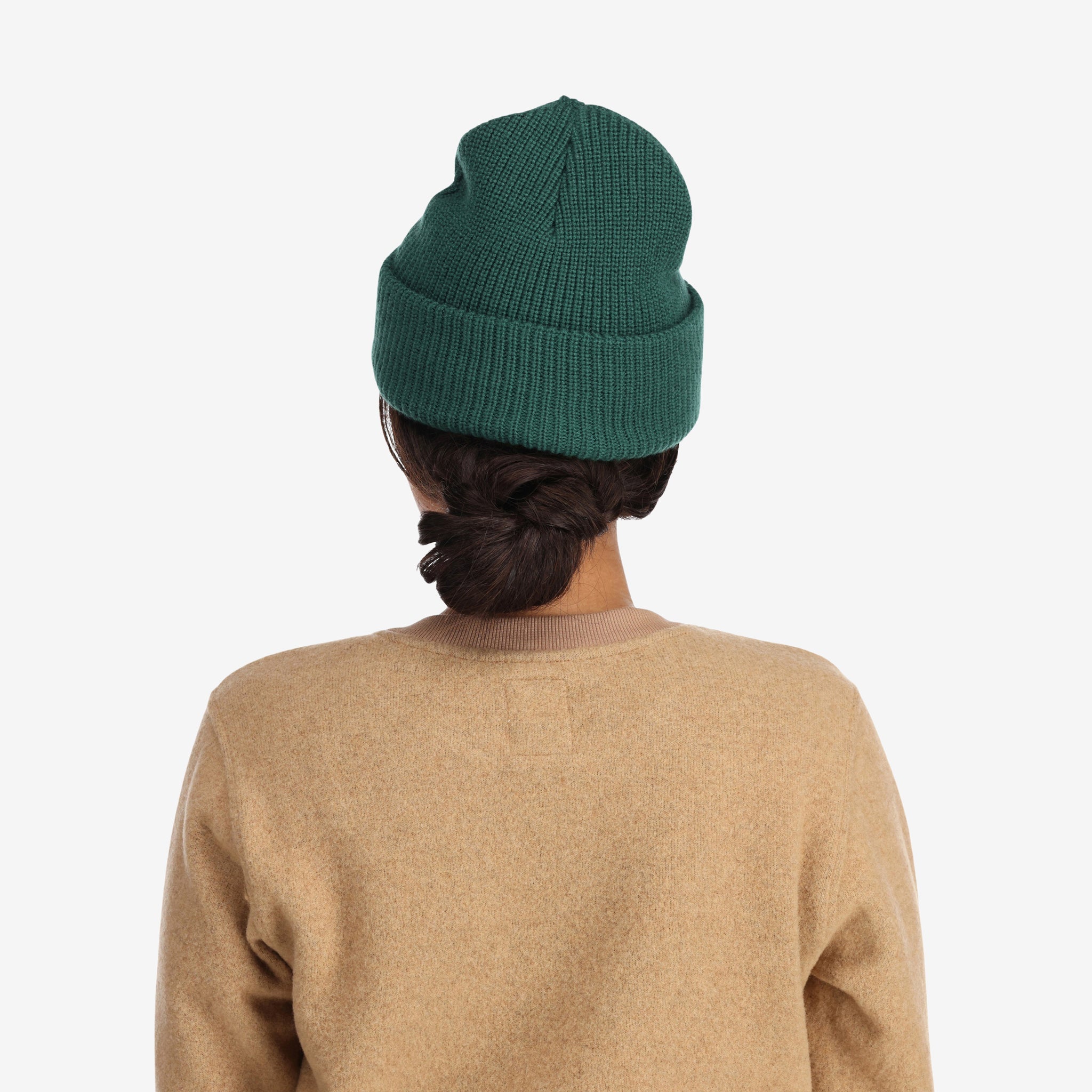 Back model shot of Topo Designs Watch Cap cuffed beanie in "forest" green.