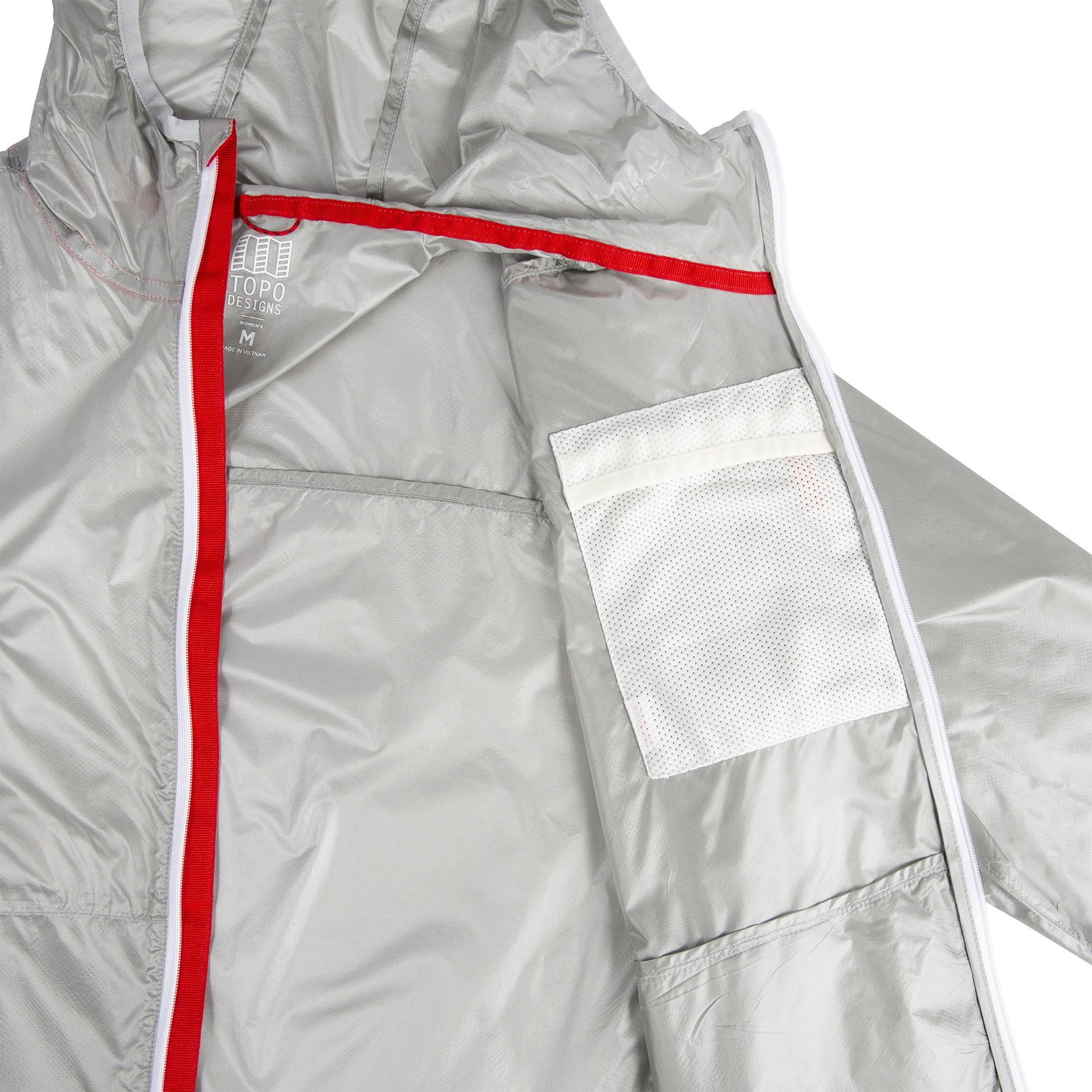 Detail shot of inside showing hidden chest pocket of Topo Designs Ultralight Jacket - Lightweight Packable Travel Jacket for Women in Silver